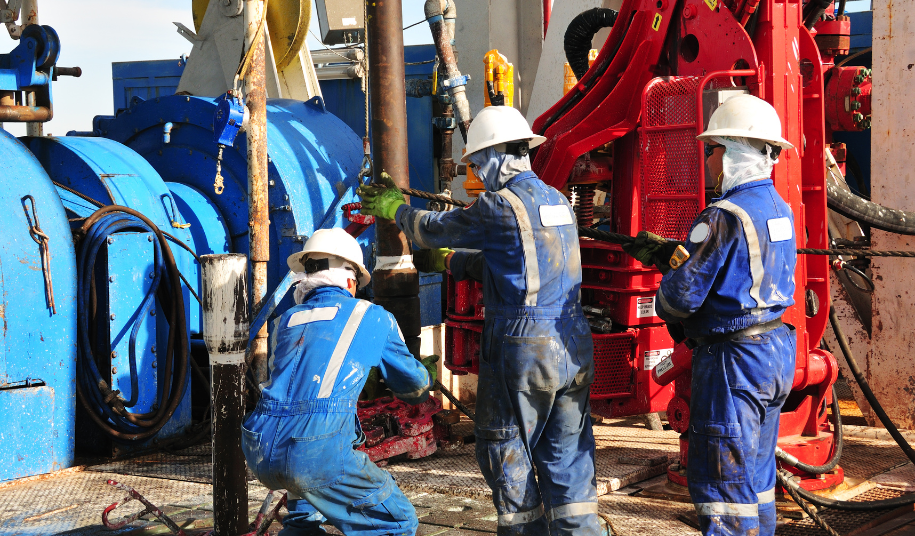oil workers working on platform - rising oil prices